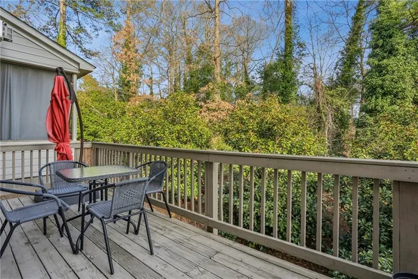 a view of balcony with furniture and wooden deck