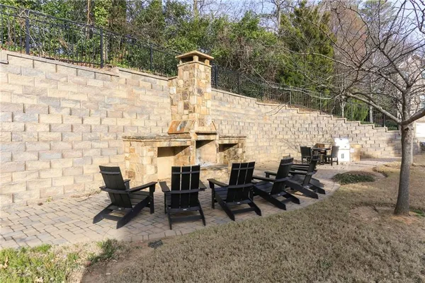 a backyard of a house with table and chairs