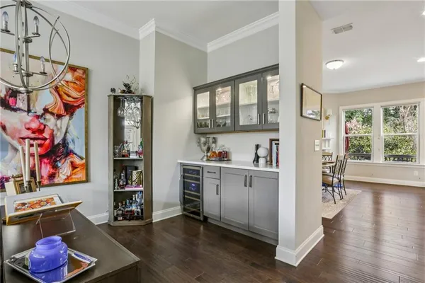 a kitchen with stainless steel appliances granite countertop a refrigerator and a stove