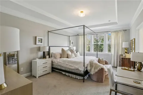 a bedroom with bed and window