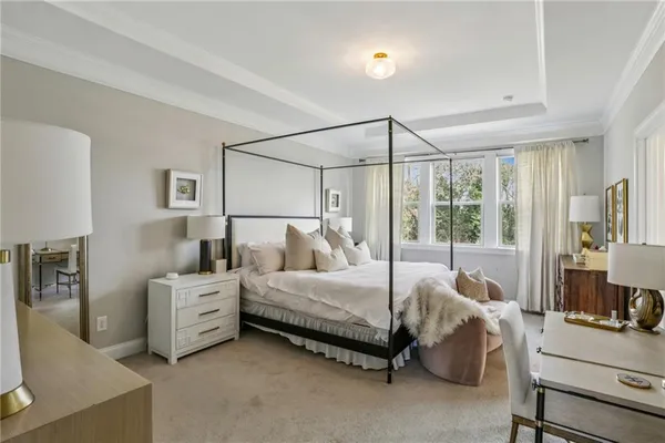 a bedroom with bed and window