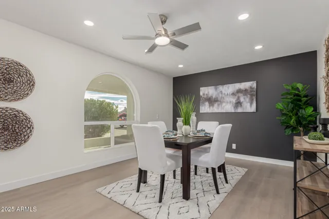 a view of a dining room with furniture window and outside view