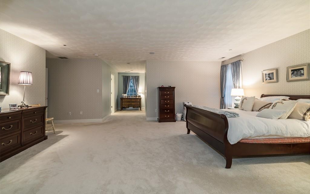 32 Parsons Hill Road Wenham, MA 01984 - Photo 20 of 29 a spacious bedroom with a bed and a dresser