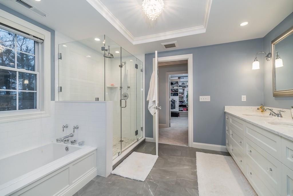 32 Parsons Hill Road Wenham, MA 01984 - Photo 22 of 29 a bathroom with a tub a sink and shower