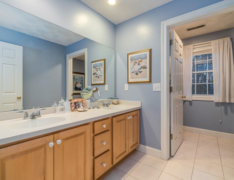32 Parsons Hill Road Wenham, MA 01984 - Photo 24 of 29 a bathroom with a sink double vanity and a mirror