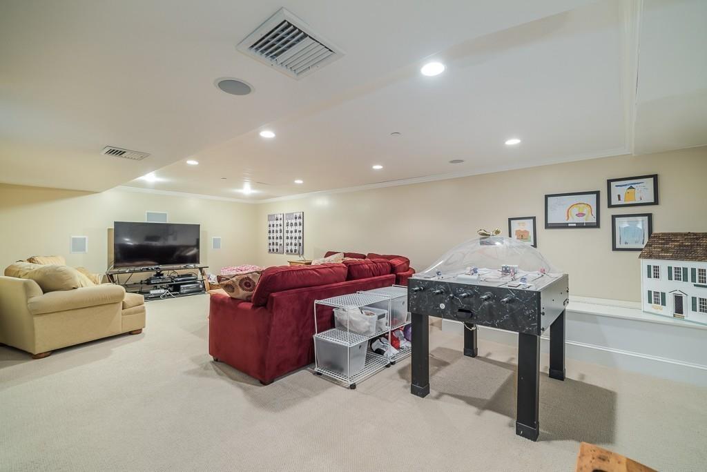 32 Parsons Hill Road Wenham, MA 01984 - Photo 26 of 29 a living room with furniture a flat screen tv and a couch