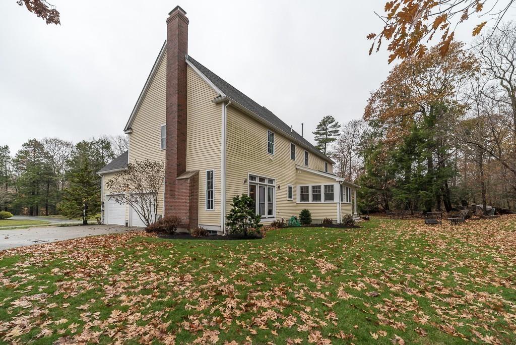 32 Parsons Hill Road Wenham, MA 01984 - Photo 27 of 29 a front view of a house with a garden