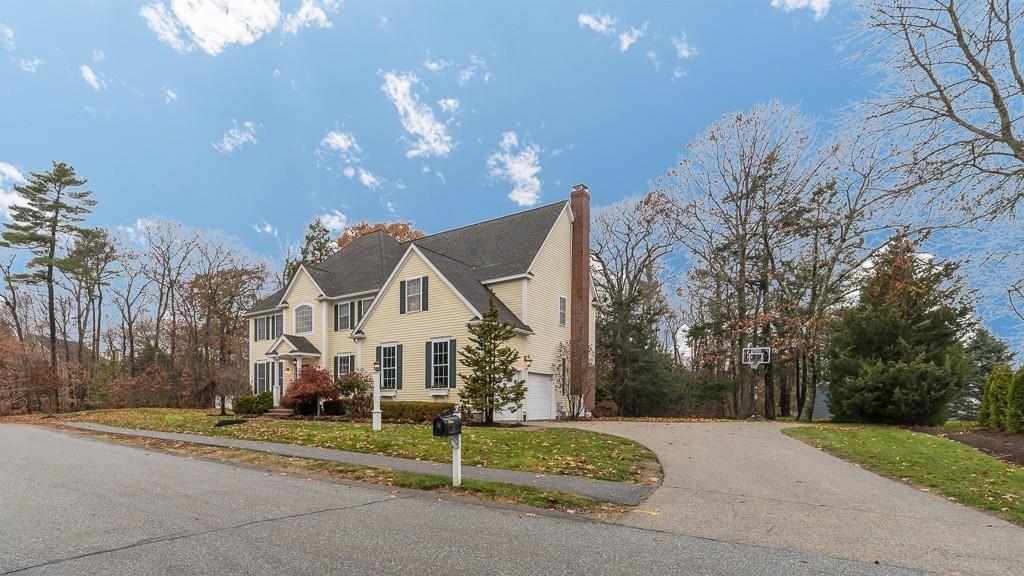 32 Parsons Hill Road Wenham, MA 01984 - Photo 4 of 29 a front view of a house with a yard and garage