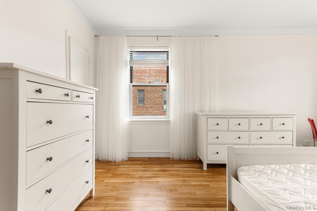100-10 67th Road, Unit 6L Queens, NY 11375 - Photo 20 of 26 a view of cabinets and window