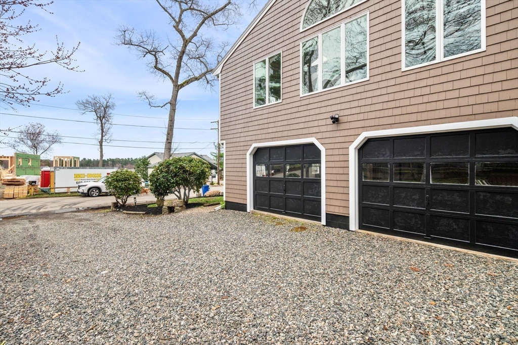 187 Echo Cove Road Hamilton, MA 01982 - Photo 35 of 42 a view of a house with a yard and garage