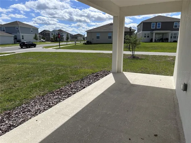 a view of a house with a back yard