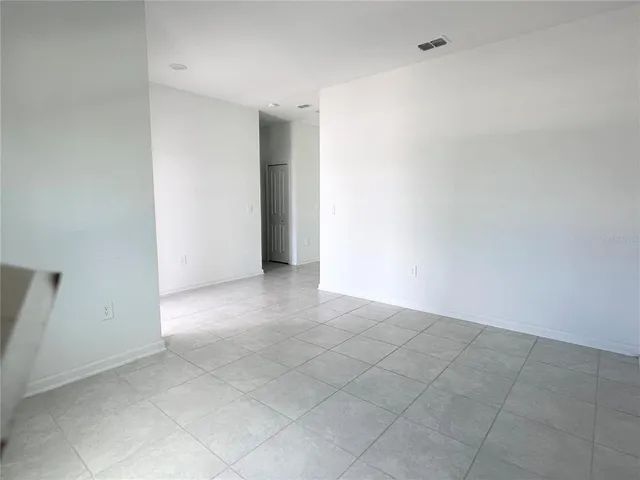 an empty room with white walls
