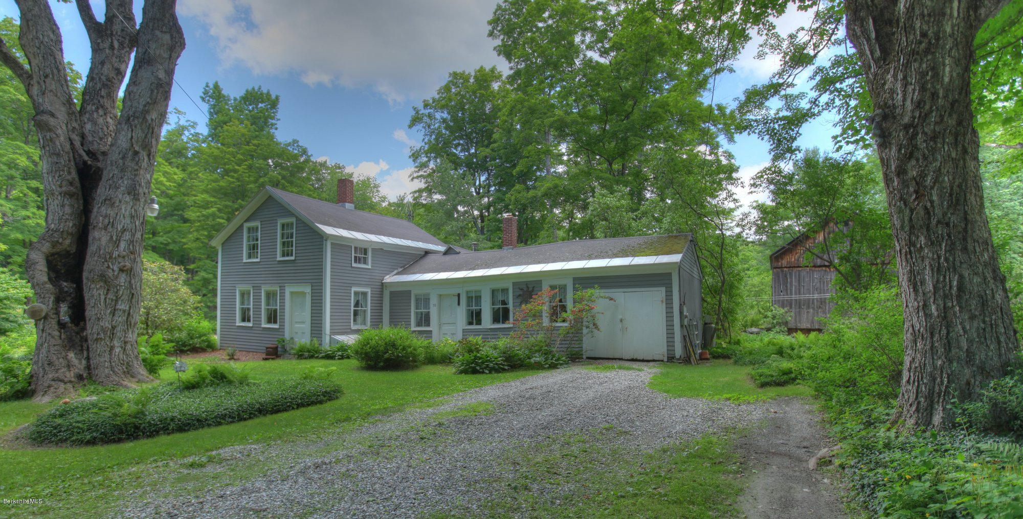 58 Mt Hunger Road Monterey, MA 01245 - Photo 1 of 32 a view of a house with yard and plants