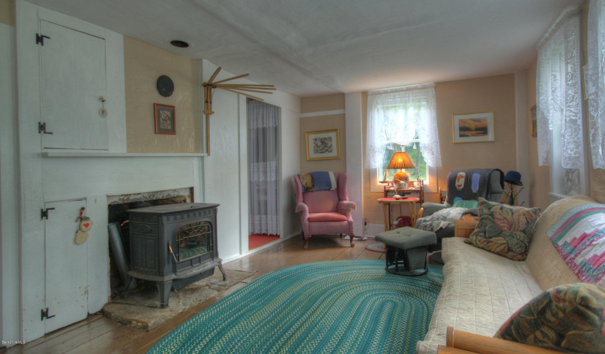 58 Mt Hunger Road Monterey, MA 01245 - Photo 15 of 32 a living room with furniture and a fireplace