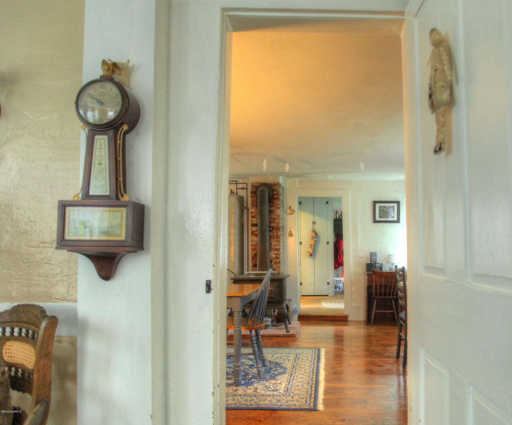 58 Mt Hunger Road Monterey, MA 01245 - Photo 16 of 32 a view of a hallway with wooden floor windows and a bathroom