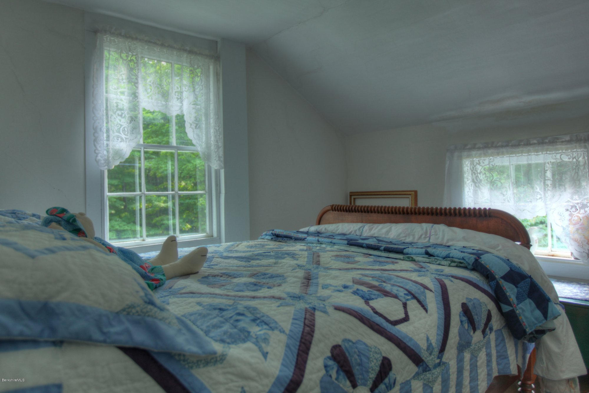 58 Mt Hunger Road Monterey, MA 01245 - Photo 19 of 32 a bedroom with a bed and wooden floor