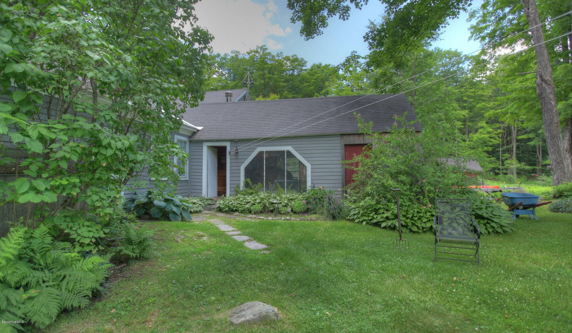 58 Mt Hunger Road Monterey, MA 01245 - Photo 28 of 32 a front view of a house with a yard
