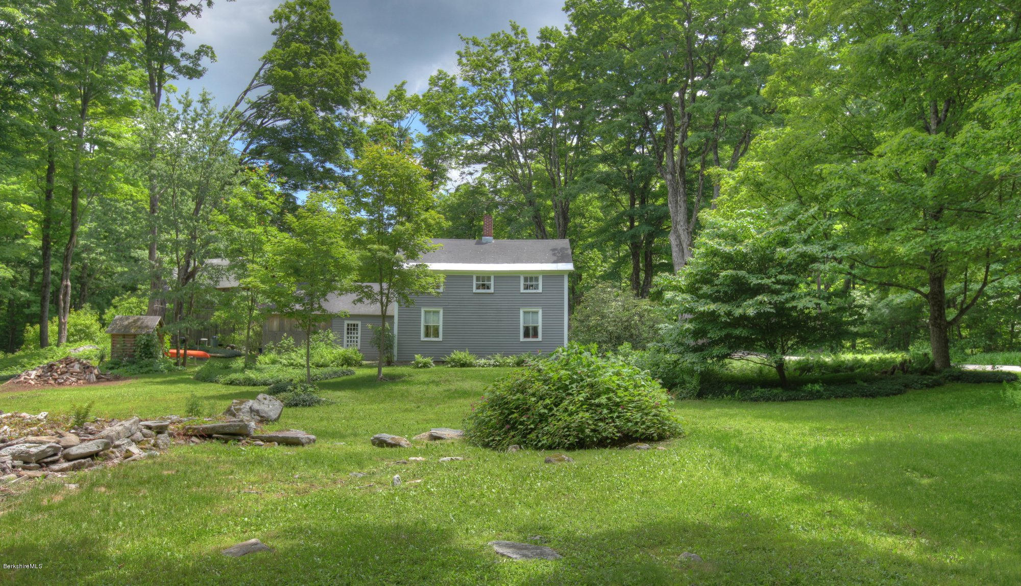 58 Mt Hunger Road Monterey, MA 01245 - Photo 4 of 32 a backyard of a house with a garden and plants