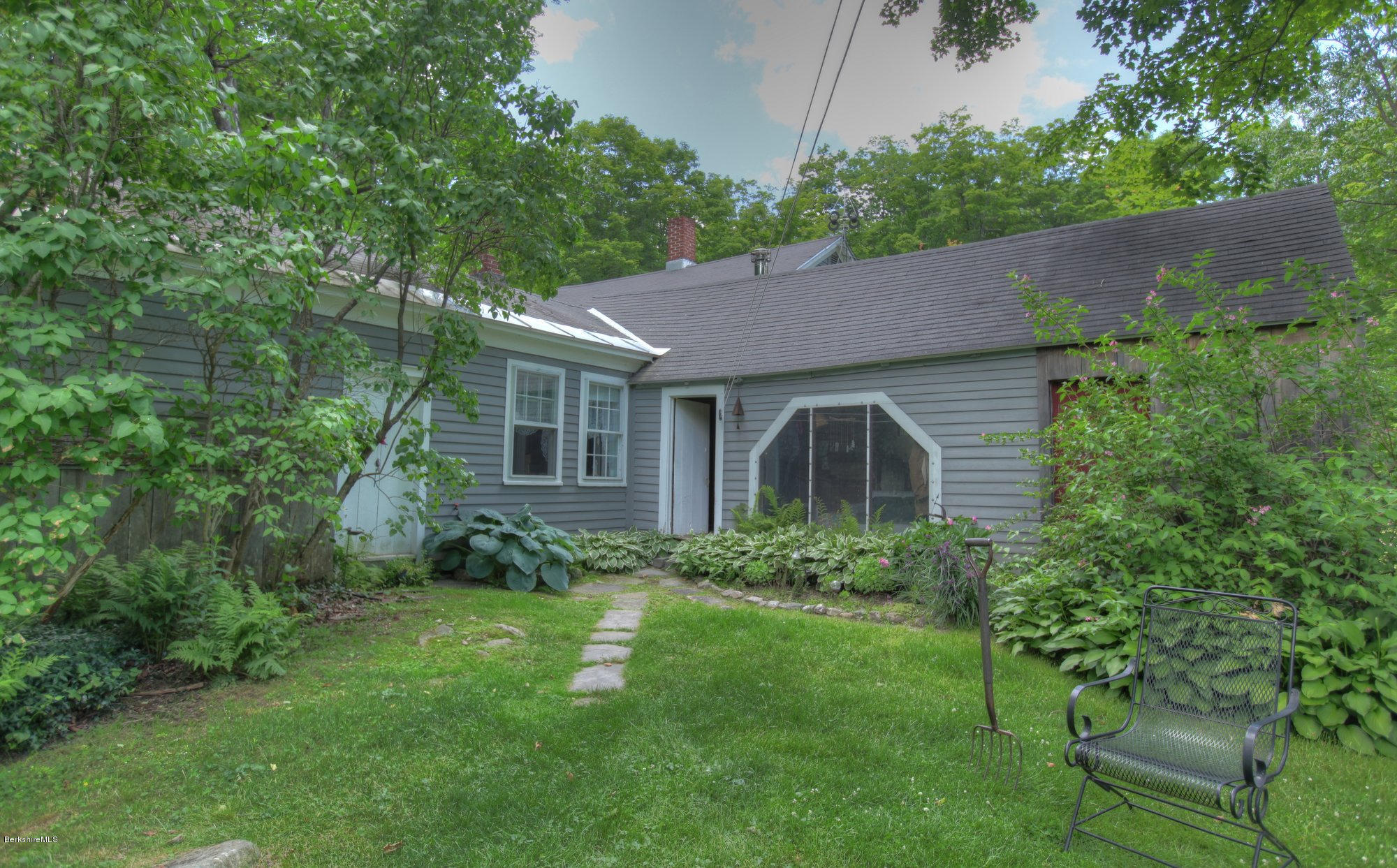 58 Mt Hunger Road Monterey, MA 01245 - Photo 7 of 32 a front view of a house with garden