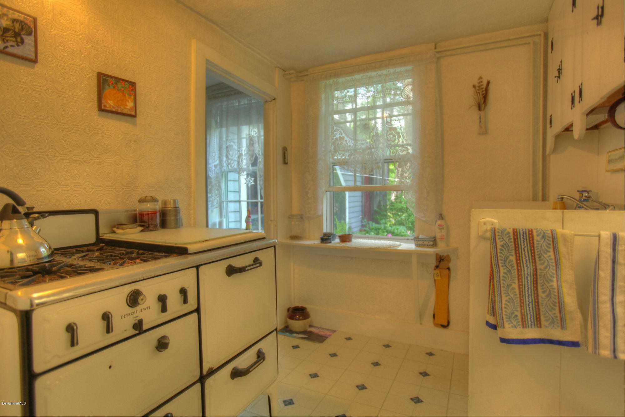 58 Mt Hunger Road Monterey, MA 01245 - Photo 9 of 32 a bathroom with a granite countertop sink and a mirror