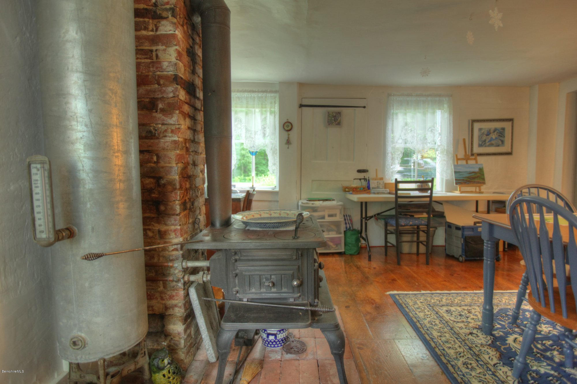 58 Mt Hunger Road Monterey, MA 01245 - Photo 10 of 32 a dining room with lots of furniture and a chandelier