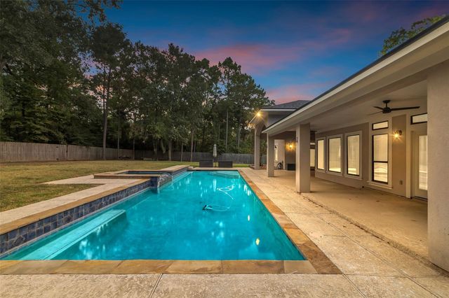 a view of swimming pool with patio