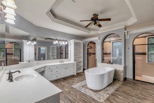 a large room with wooden floor and windows