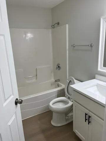 a bathroom with a sink a toilet and a bathtub
