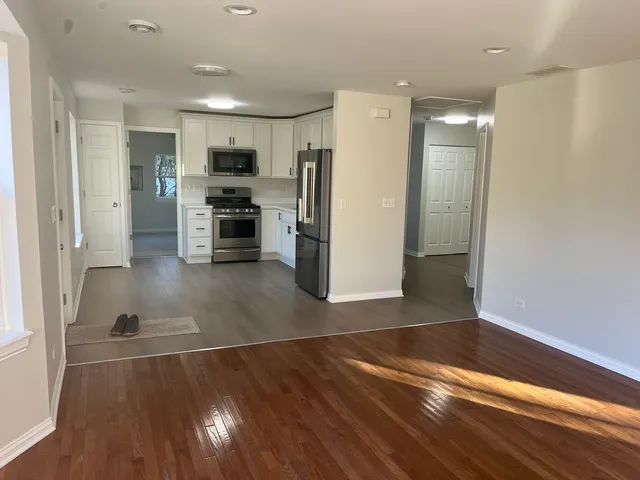 a view of kitchen with cabinets and stainless steel appliances