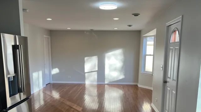 a view of an empty room and a windows