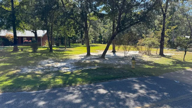 a view of swimming pool with a trees