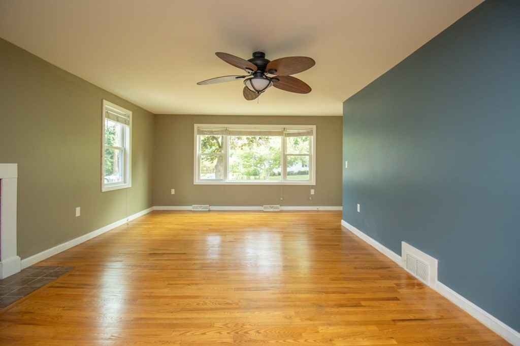 139 Fox Hill Road Springfield, MA 01118 - Photo 12 of 36 a view of an empty room with window and wooden floor