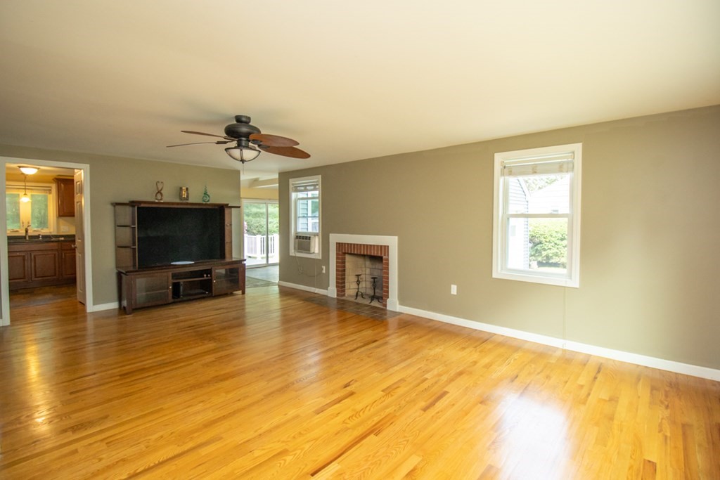 139 Fox Hill Road Springfield, MA 01118 - Photo 16 of 36 a view of a livingroom with a flat screen tv and kitchen view