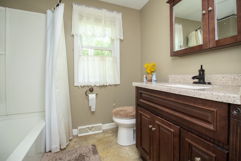 139 Fox Hill Road Springfield, MA 01118 - Photo 27 of 36 a bathroom with a granite countertop toilet sink and mirror