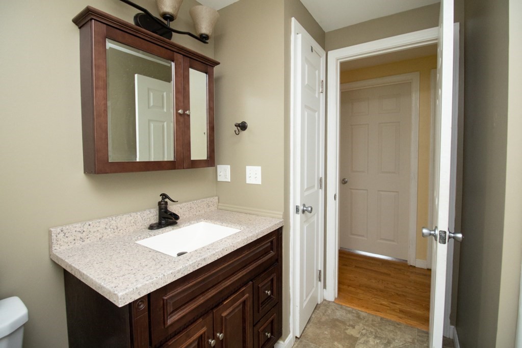 139 Fox Hill Road Springfield, MA 01118 - Photo 28 of 36 a bathroom with a sink and a mirror