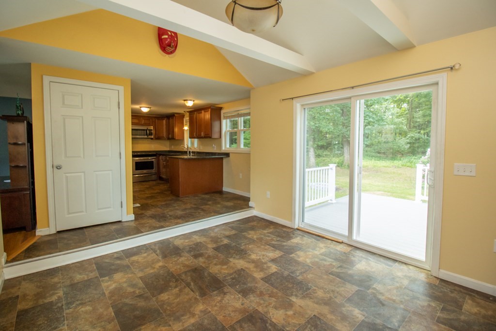139 Fox Hill Road Springfield, MA 01118 - Photo 5 of 36 a view of a livingroom with a kitchen and a window
