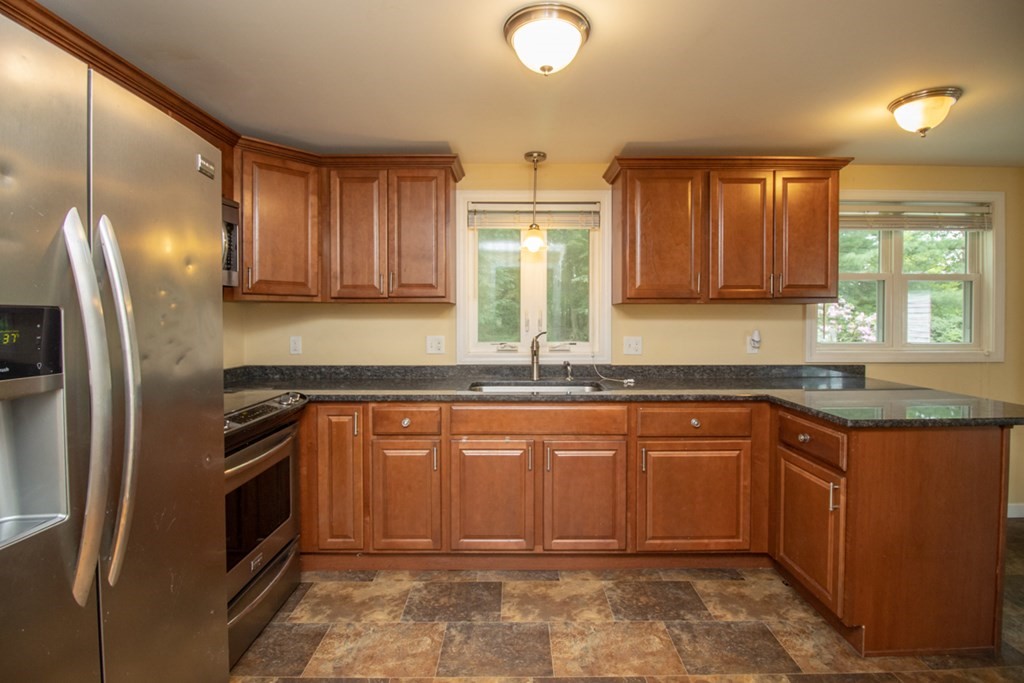 139 Fox Hill Road Springfield, MA 01118 - Photo 9 of 36 a kitchen with stainless steel appliances granite countertop a sink stove and refrigerator