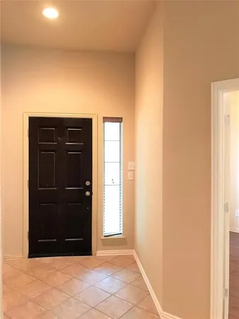 a view of entryway with a wooden door