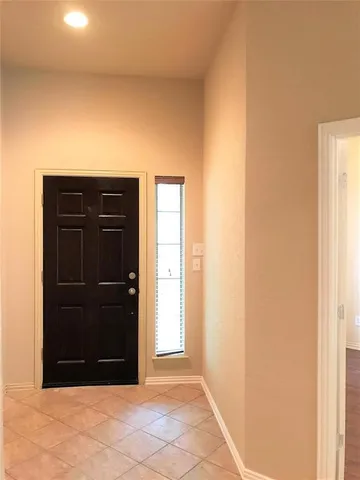 a view of entryway with a wooden door