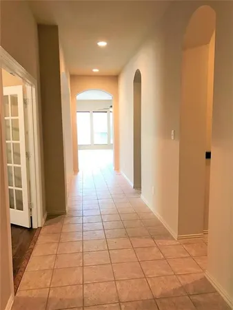 a view of a room with a hallway