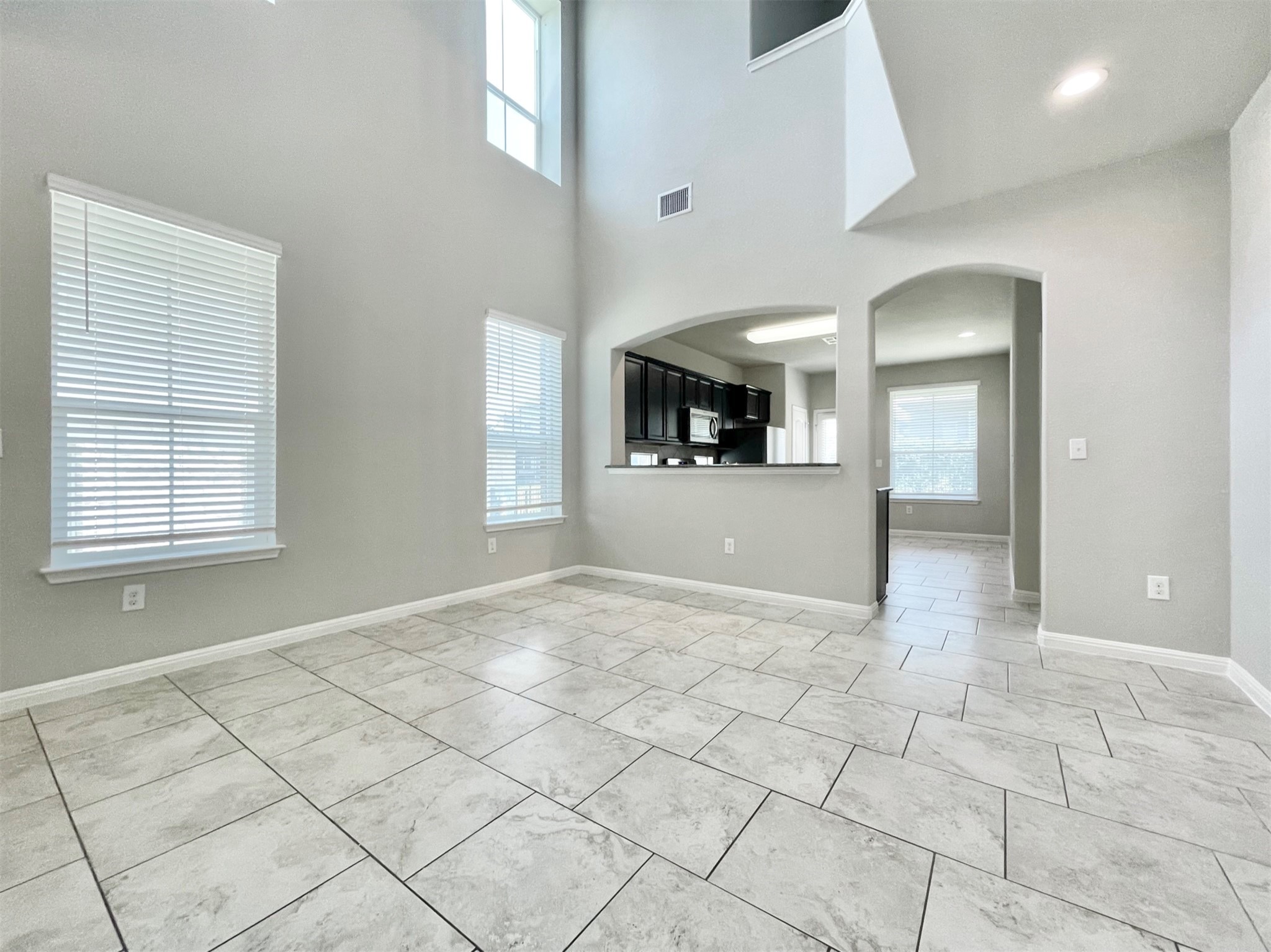 407 Rhetoric Way Pflugerville, TX 78660 - Photo 6 of 38 an empty room with windows and entrance