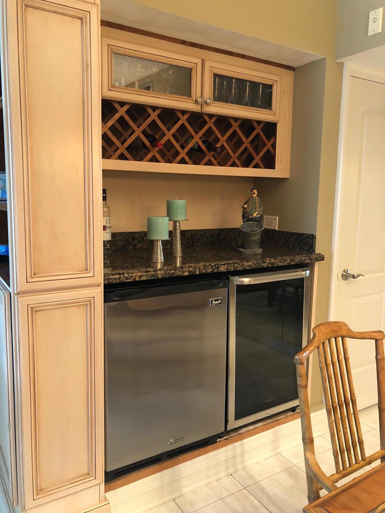 3400 North Ocean Drive, Unit 306 Riviera Beach, FL 33404 - Photo 11 of 52 a kitchen with a sink and a refrigerator