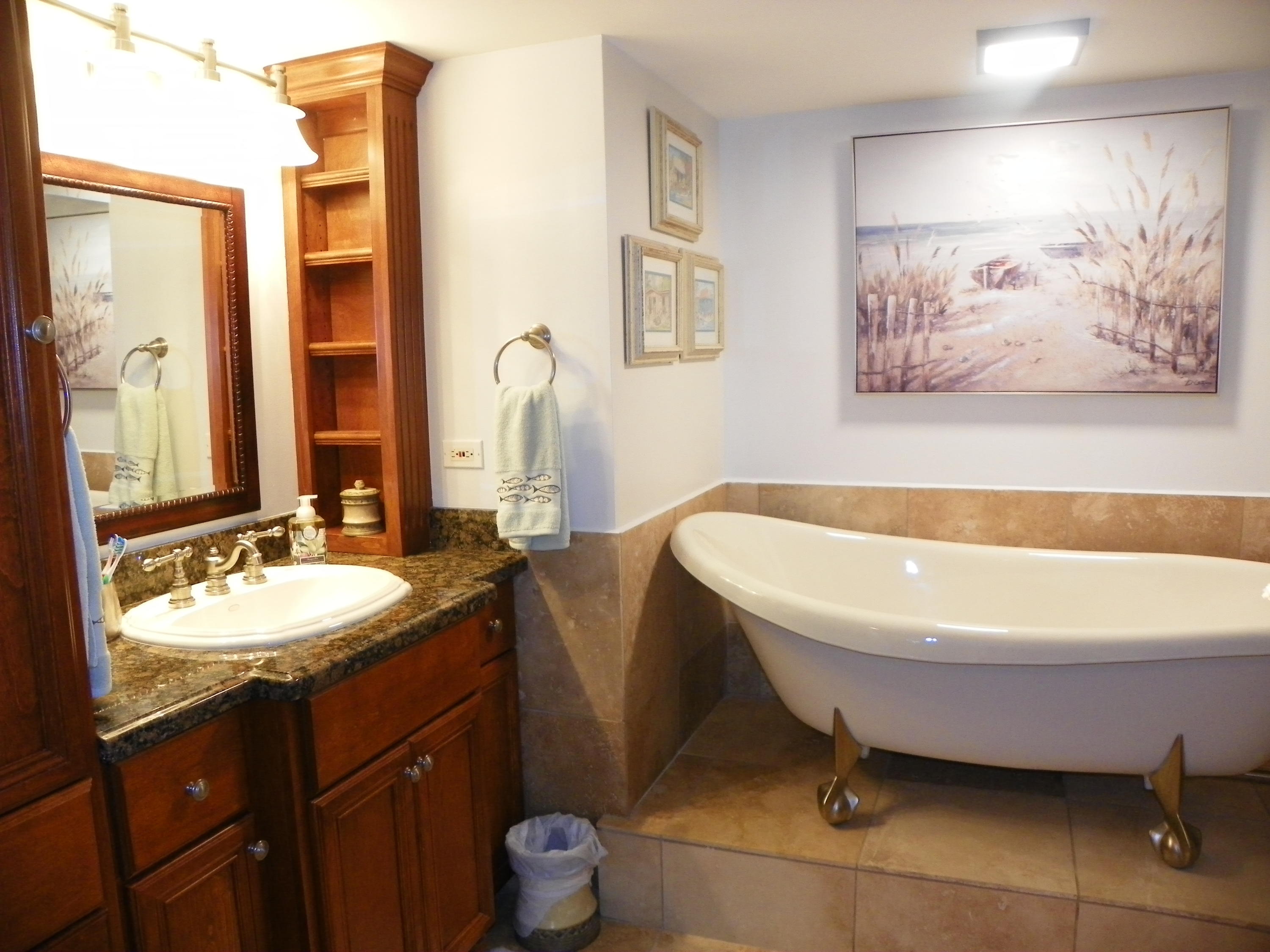 3400 North Ocean Drive, Unit 306 Riviera Beach, FL 33404 - Photo 17 of 52 a bathroom with a bathtub sink and toilet