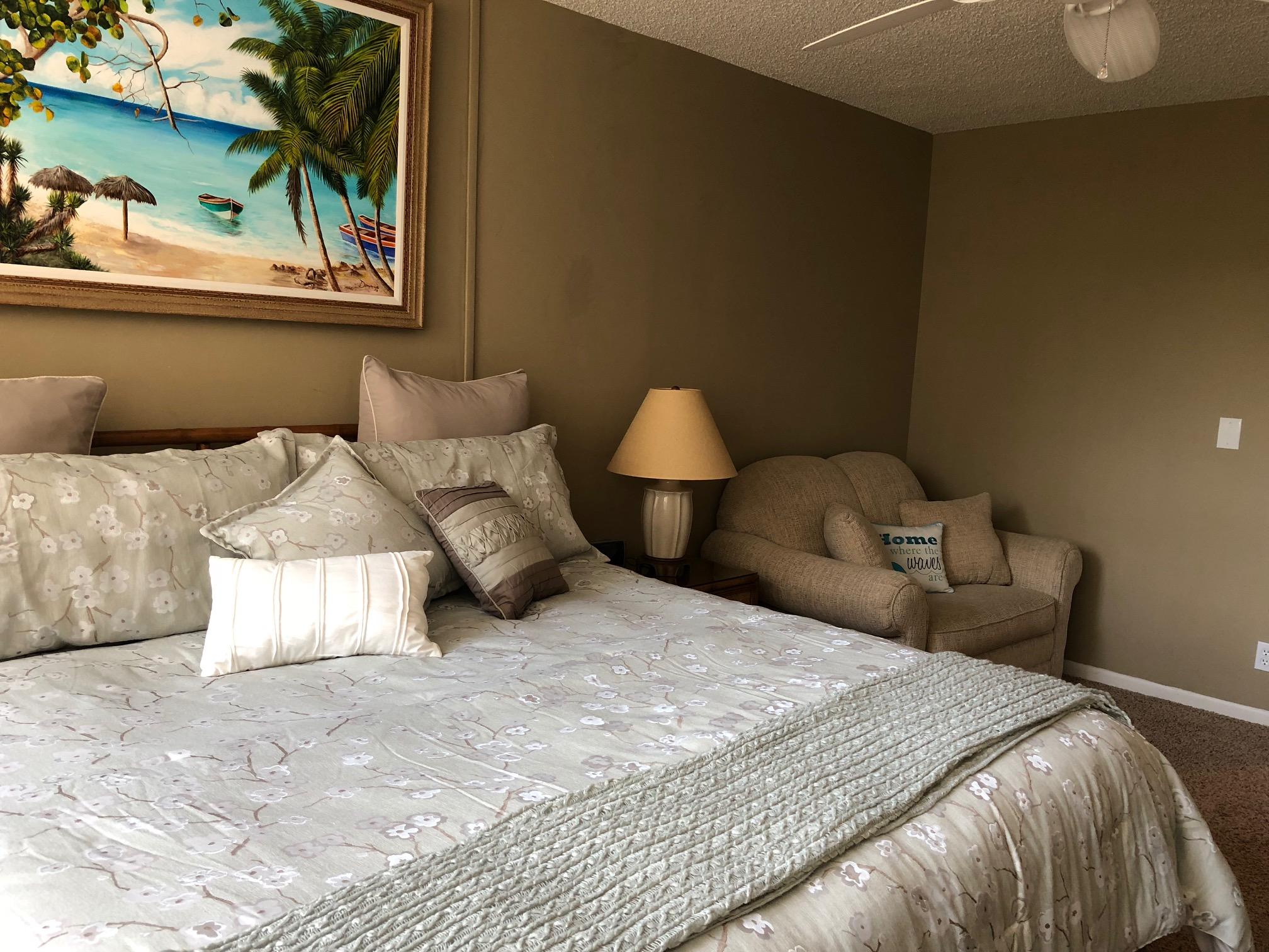3400 North Ocean Drive, Unit 306 Riviera Beach, FL 33404 - Photo 22 of 52 a bedroom with a bed and a painting on the wall