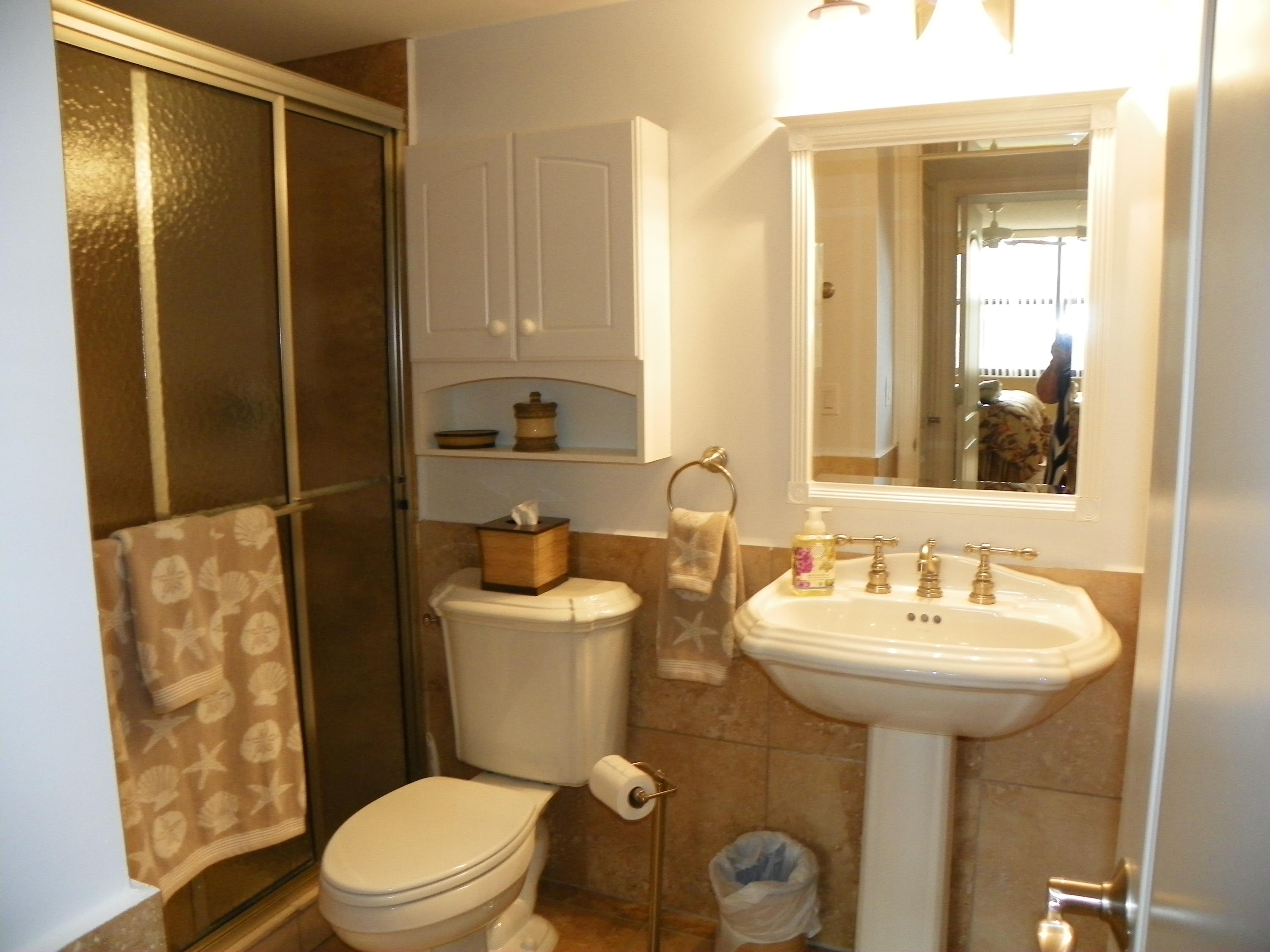 3400 North Ocean Drive, Unit 306 Riviera Beach, FL 33404 - Photo 24 of 52 a bathroom with a sink mirror toilet and shower