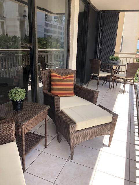 3400 North Ocean Drive, Unit 306 Riviera Beach, FL 33404 - Photo 25 of 52 a building outdoor space with patio furniture and potted plants