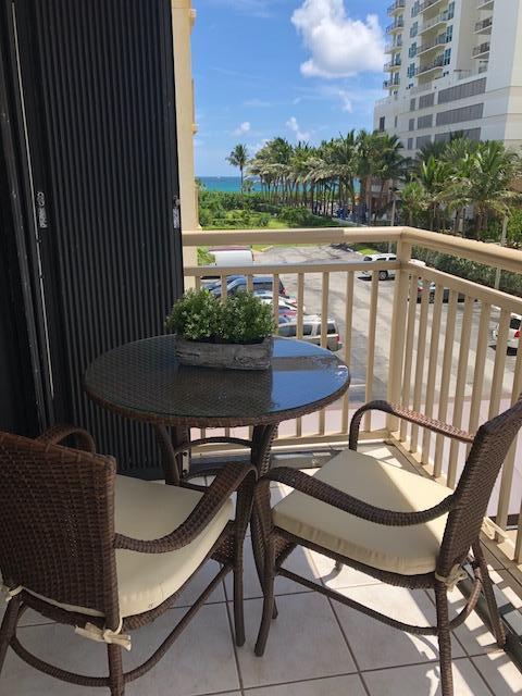 3400 North Ocean Drive, Unit 306 Riviera Beach, FL 33404 - Photo 26 of 52 a view of balcony with wooden floor and outdoor seating