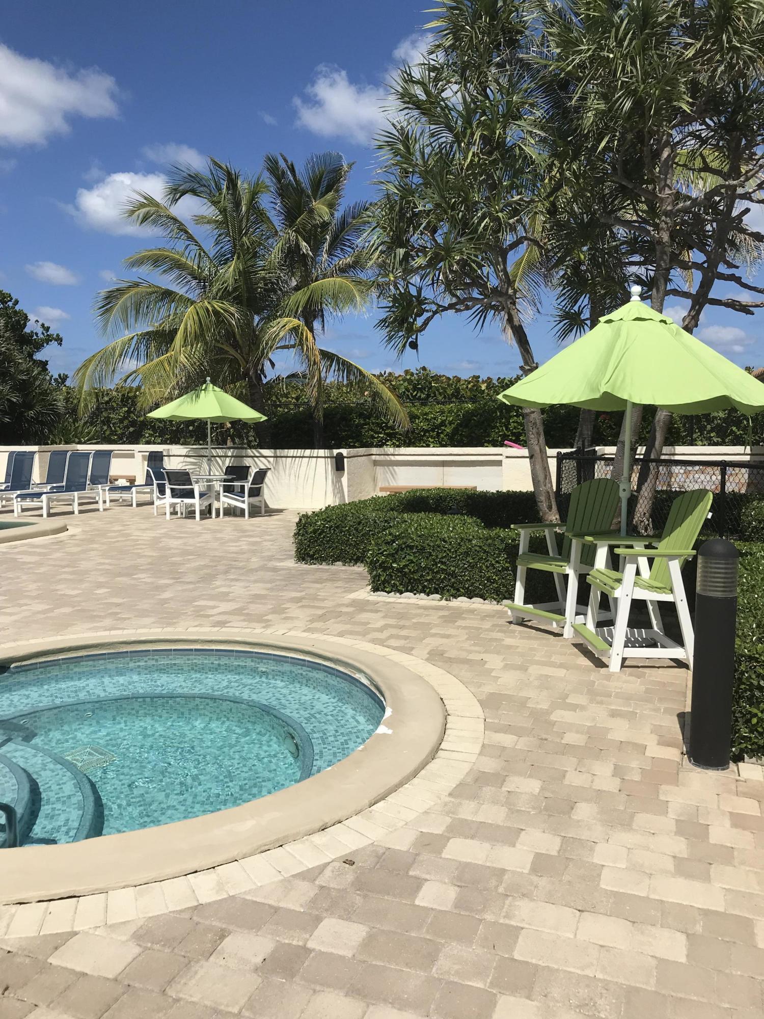 3400 North Ocean Drive, Unit 306 Riviera Beach, FL 33404 - Photo 32 of 52 a view of a swimming pool with a patio