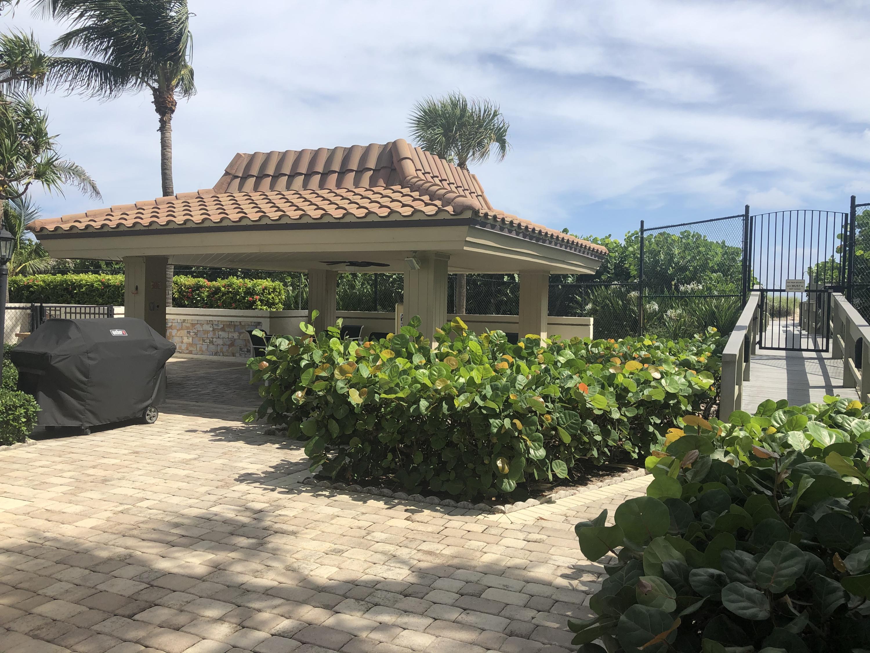 3400 North Ocean Drive, Unit 306 Riviera Beach, FL 33404 - Photo 37 of 52 a front view of a house with a yard