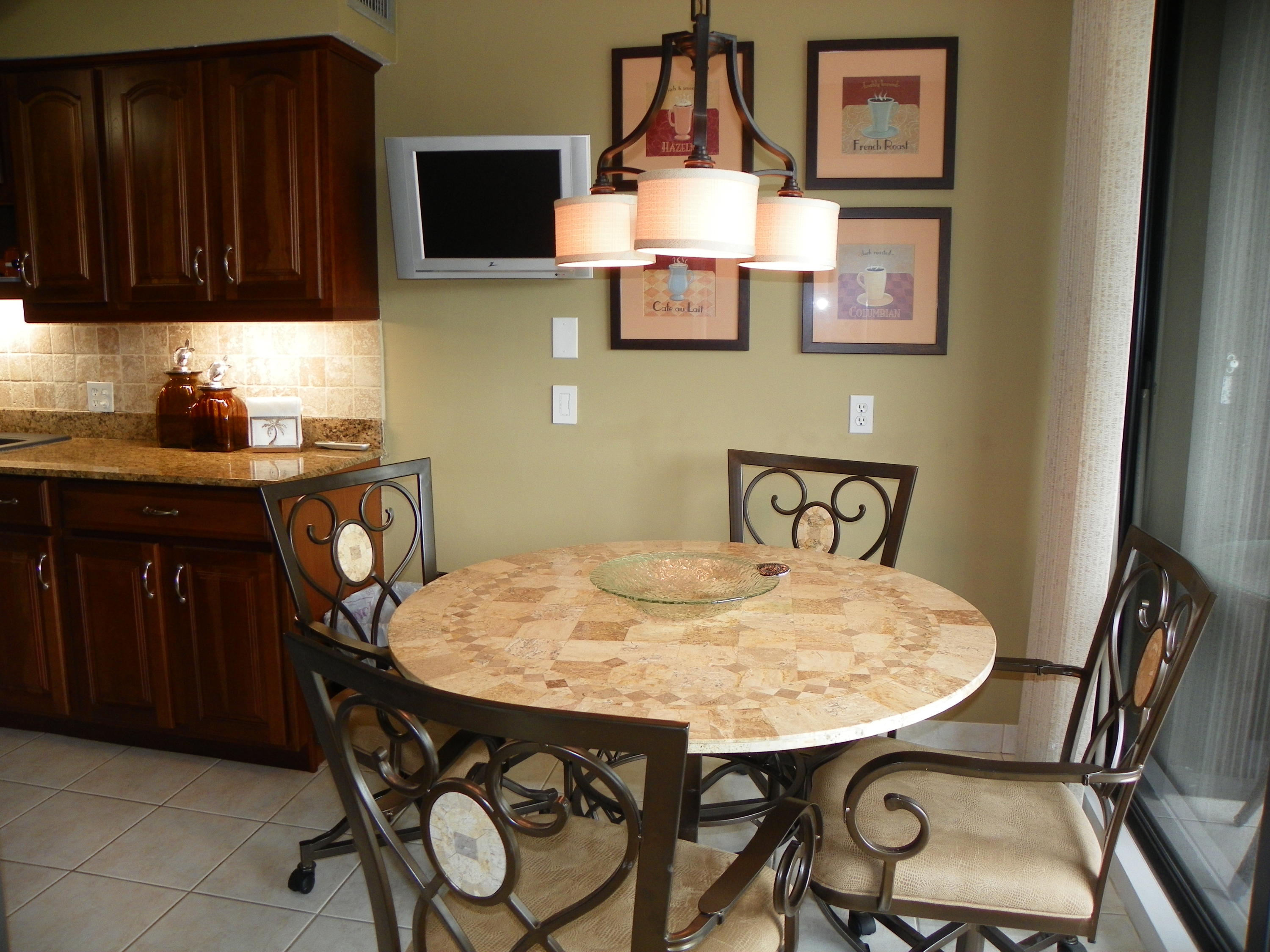 3400 North Ocean Drive, Unit 306 Riviera Beach, FL 33404 - Photo 5 of 52 a view of a dining room with furniture